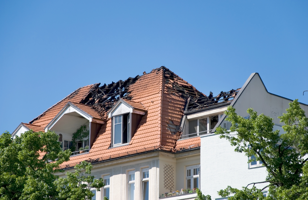 independent insurance adjuster to inspect damage from a house fire