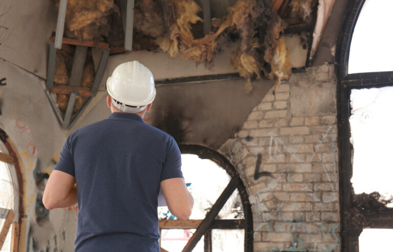 claims adjuster inspecting fire damage