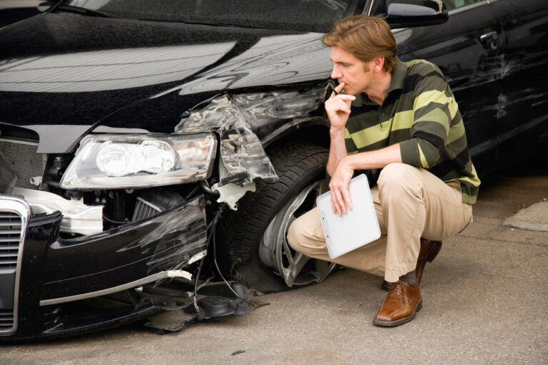 adjuster reviewing a car accident