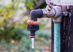 frozen water coming out of water spigot