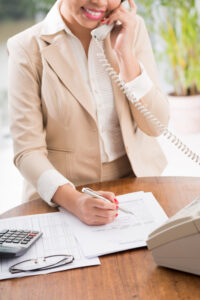 woman filling out a form for insurance