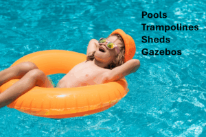 boy floating in inner tube in pool